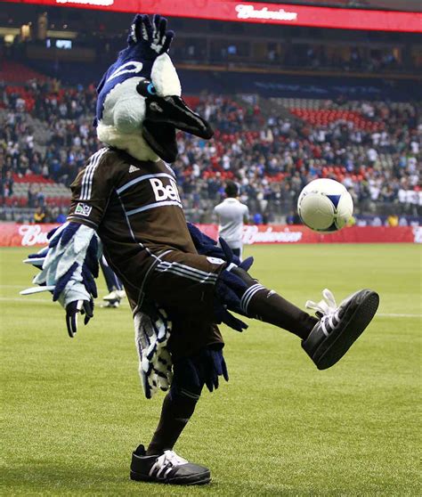 Mascots kicking a ball